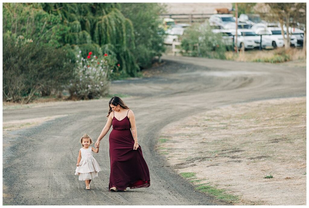Bridesmaid and daughter walking at Olympias Valley Estate wedding