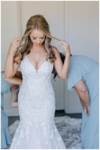 Bride putting on dress at St. Francis Winery Wedding