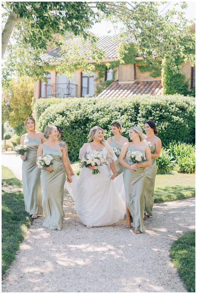 bridesmaids walking at vintners resort wedding 