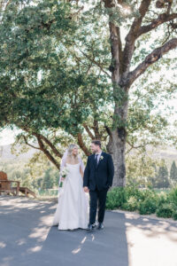 couples portraits walking through healdsburg winery