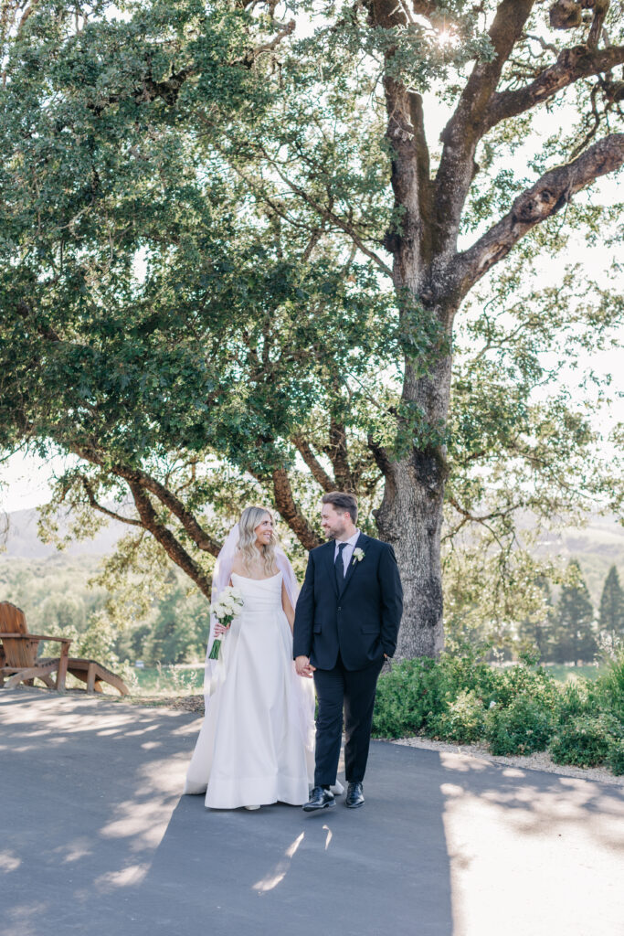 couples portraits walking through healdsburg winery 