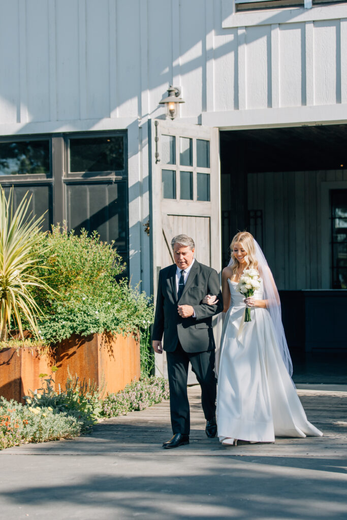 bride and dad walking down aisle at sonoma county winery wedding 