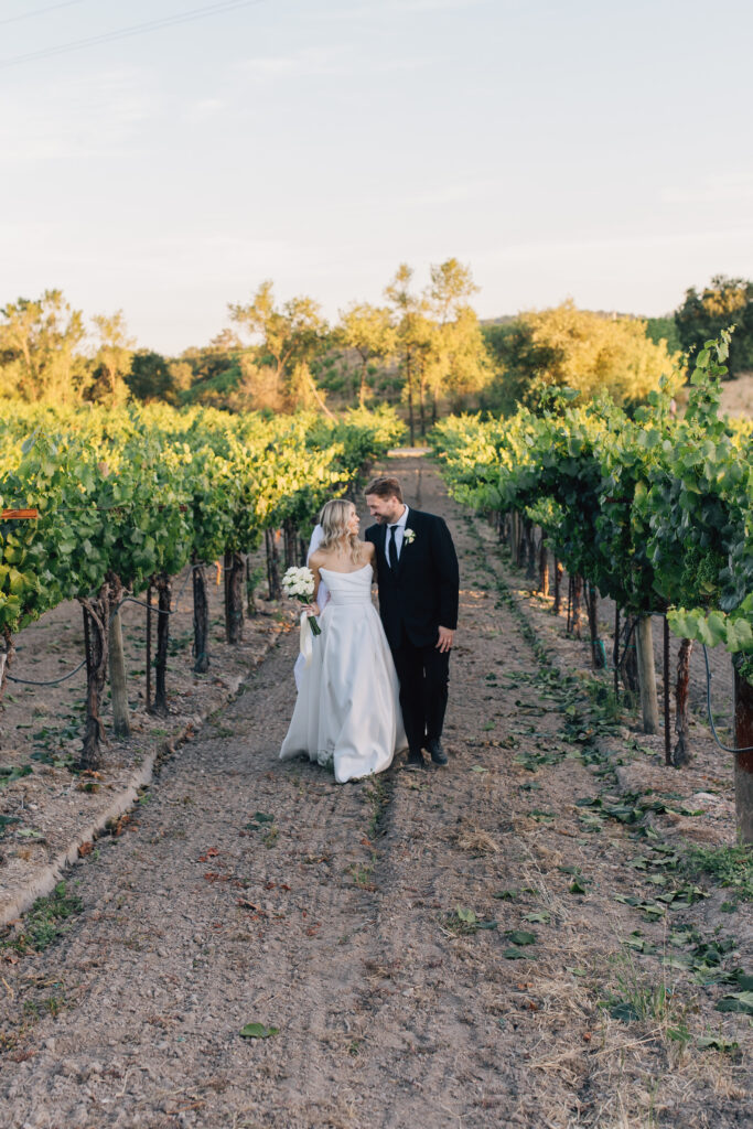 couple in vineyards at healdsburg winery wedding 