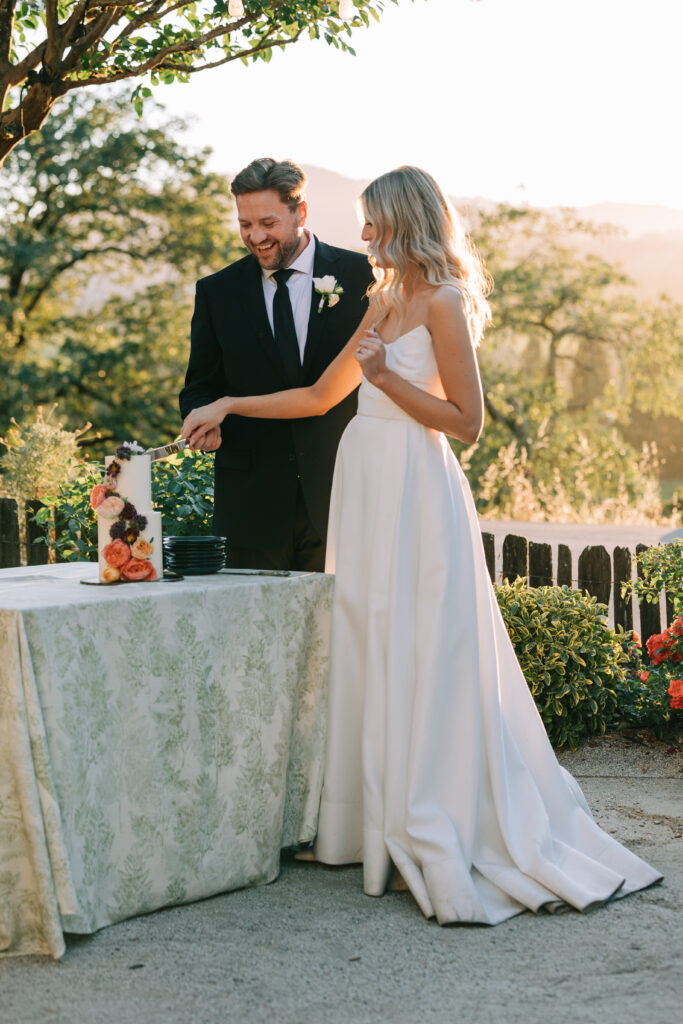 Bride and Groom cutting cake at Copain Winery