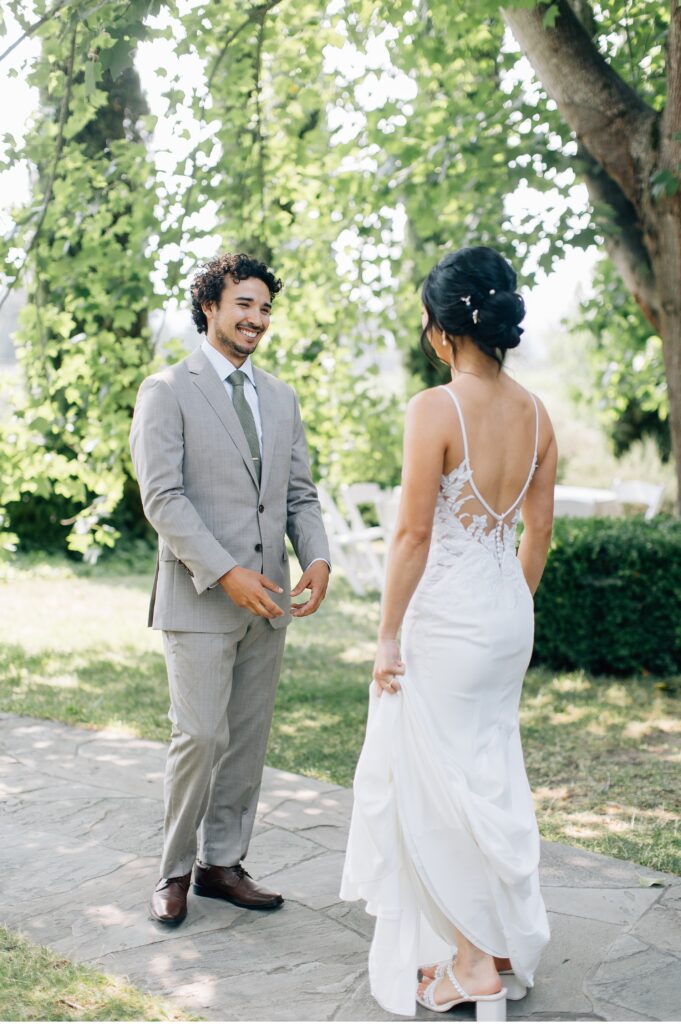 first look grooms reaction to bride at vine hill house