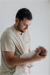 dad holding baby