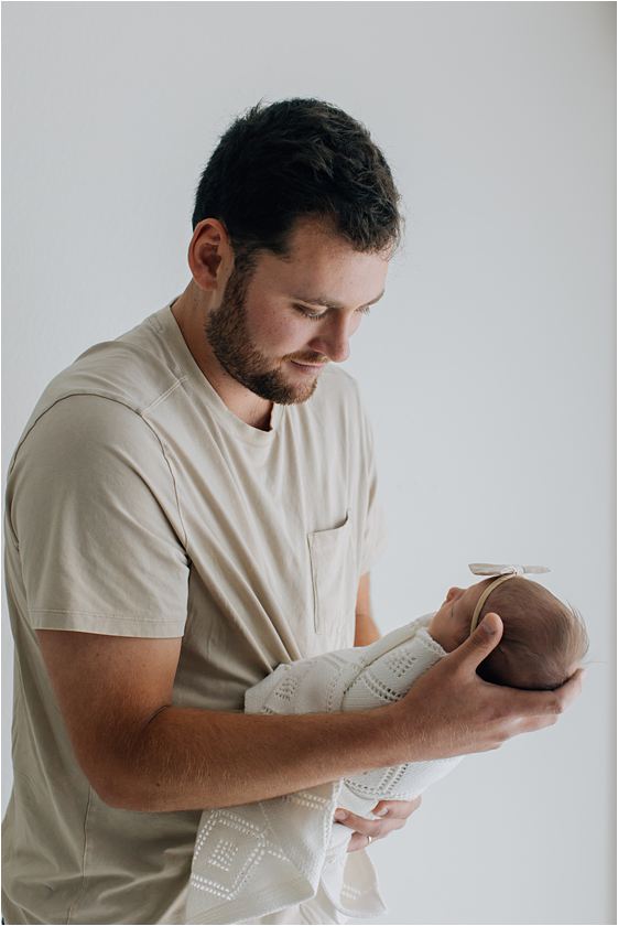dad holding baby 
