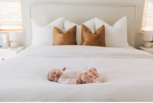 newborn baby on bed photo