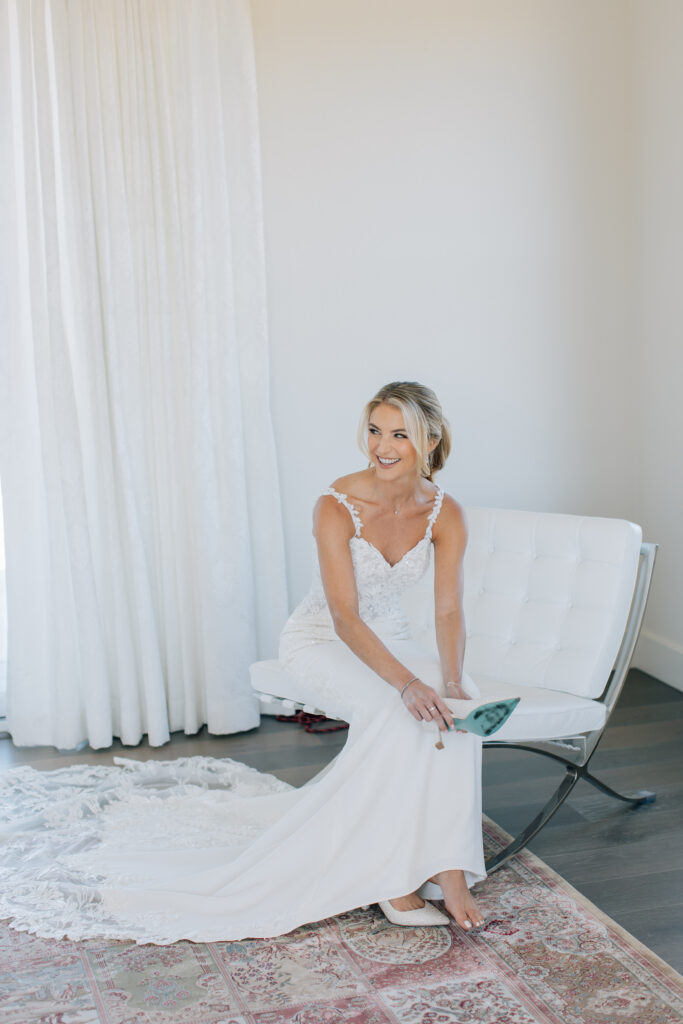bride putting shoes on for sonoma winery wedding